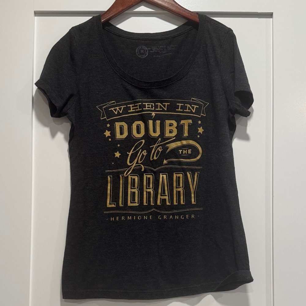 Out of Print Black Tee with Gold Library Quote